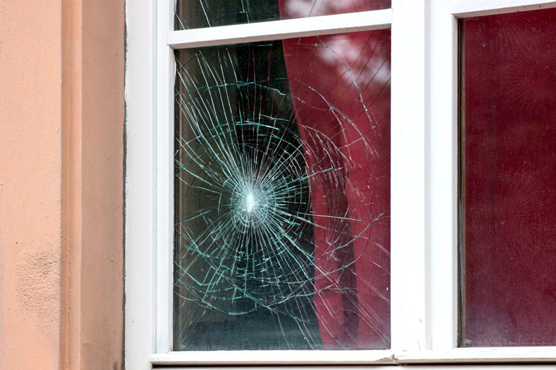 Broken window in a home needing glass replacement in Coppell, TX
